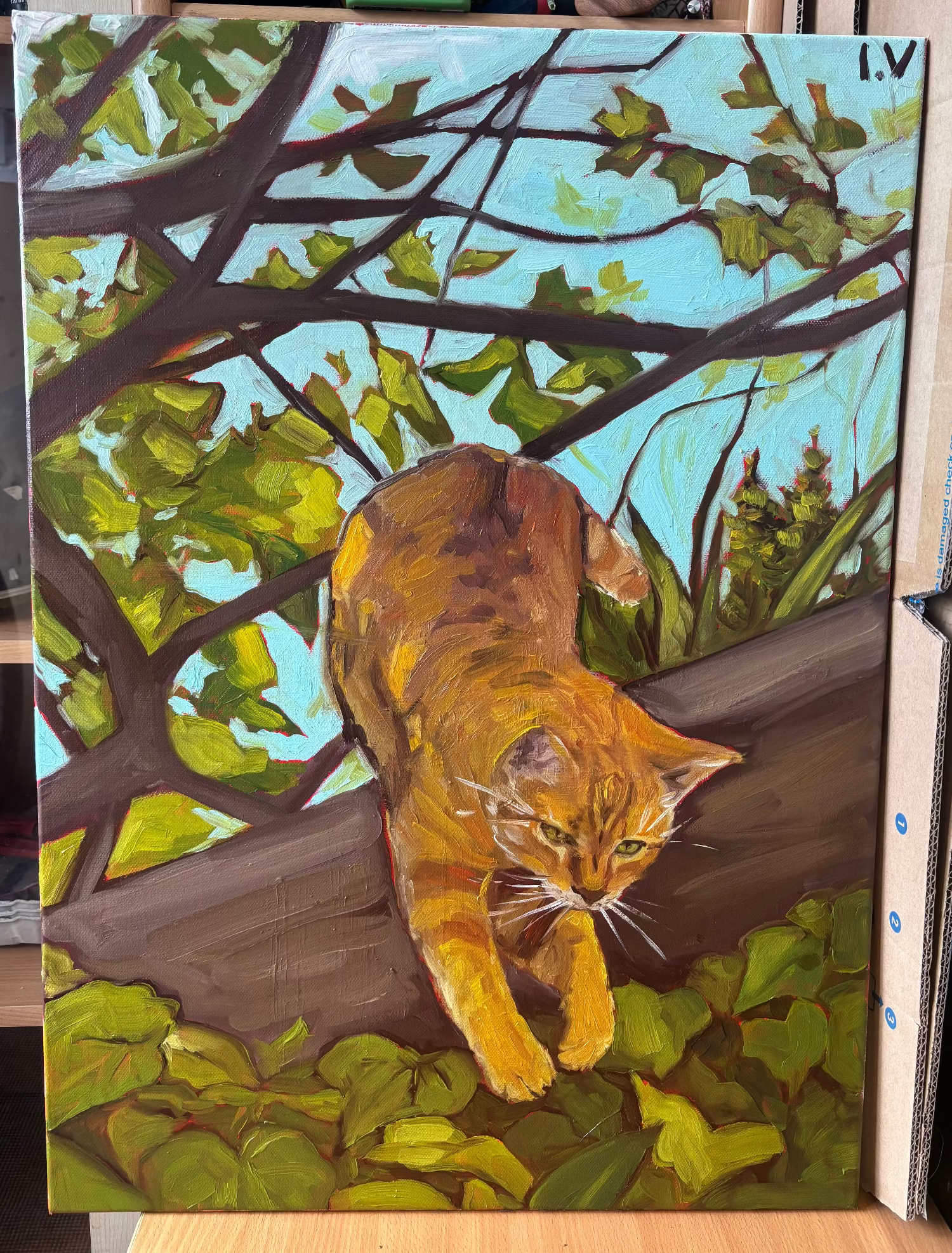 Painting of a cat on a branch with green leaves and blue sky